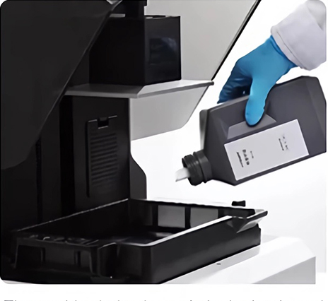 Pouring resin into 3D printer tank after shaking